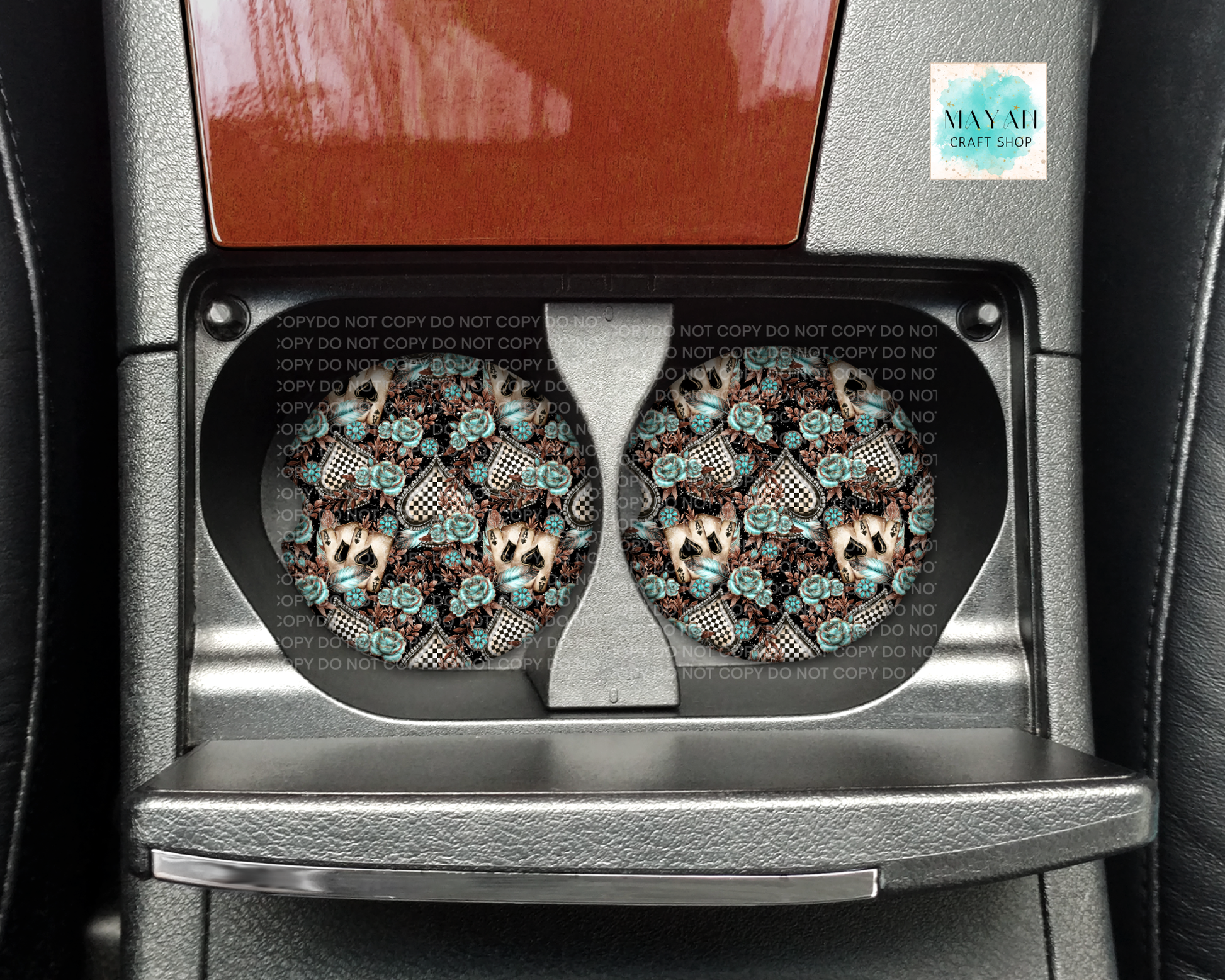 Car cup holder with two decorative coasters featuring a dog design.