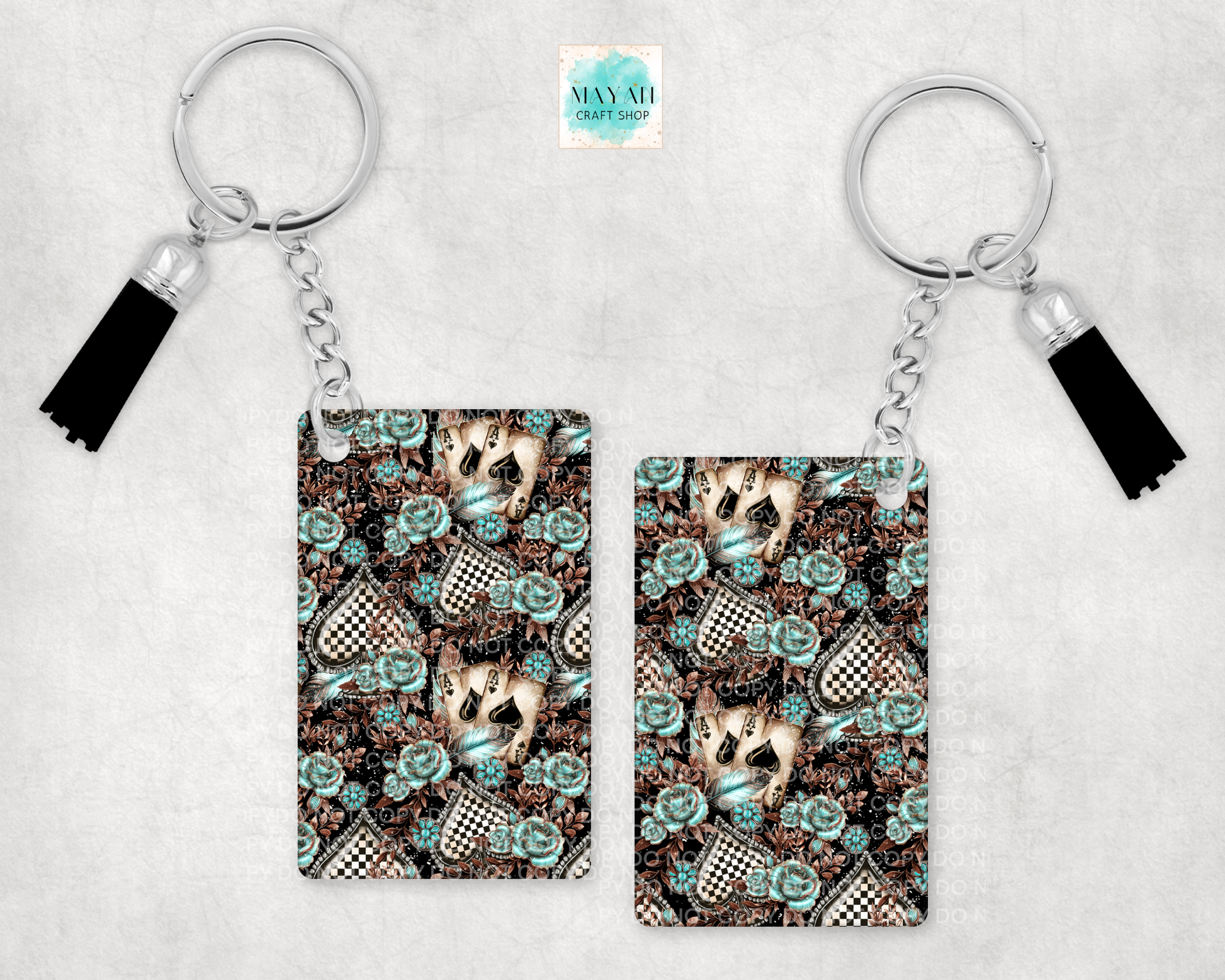 Two keychains with a floral and checkered pattern on a light gray background.