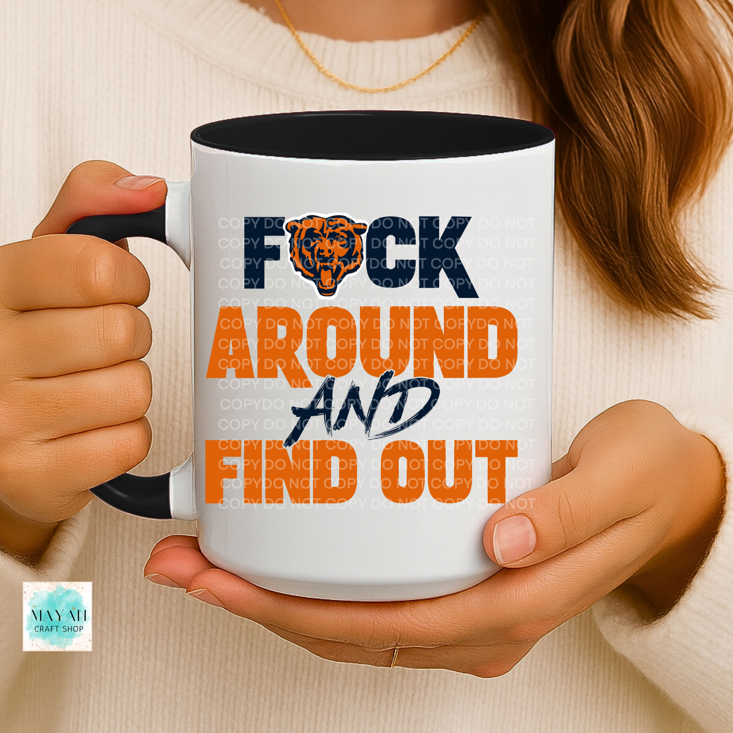 Person holding a mug with text 'F*ck Around and Find Out' in a casual setting.