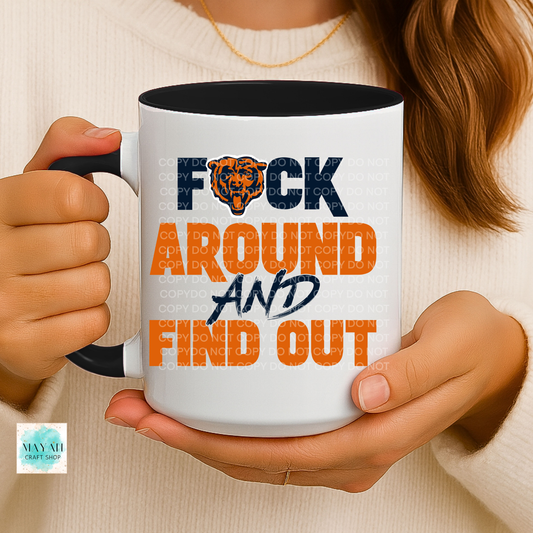 Person holding a mug with text 'F*ck Around and Find Out' in a casual setting.