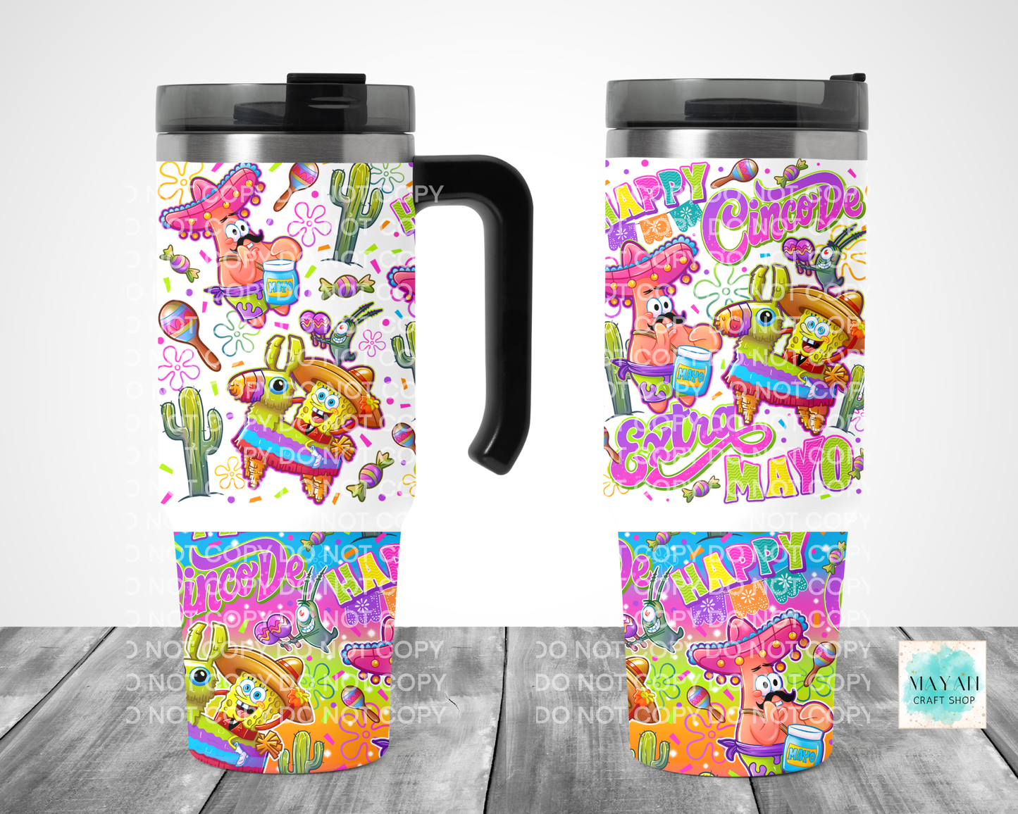 Colorful travel mug with festive design on a wooden surface
