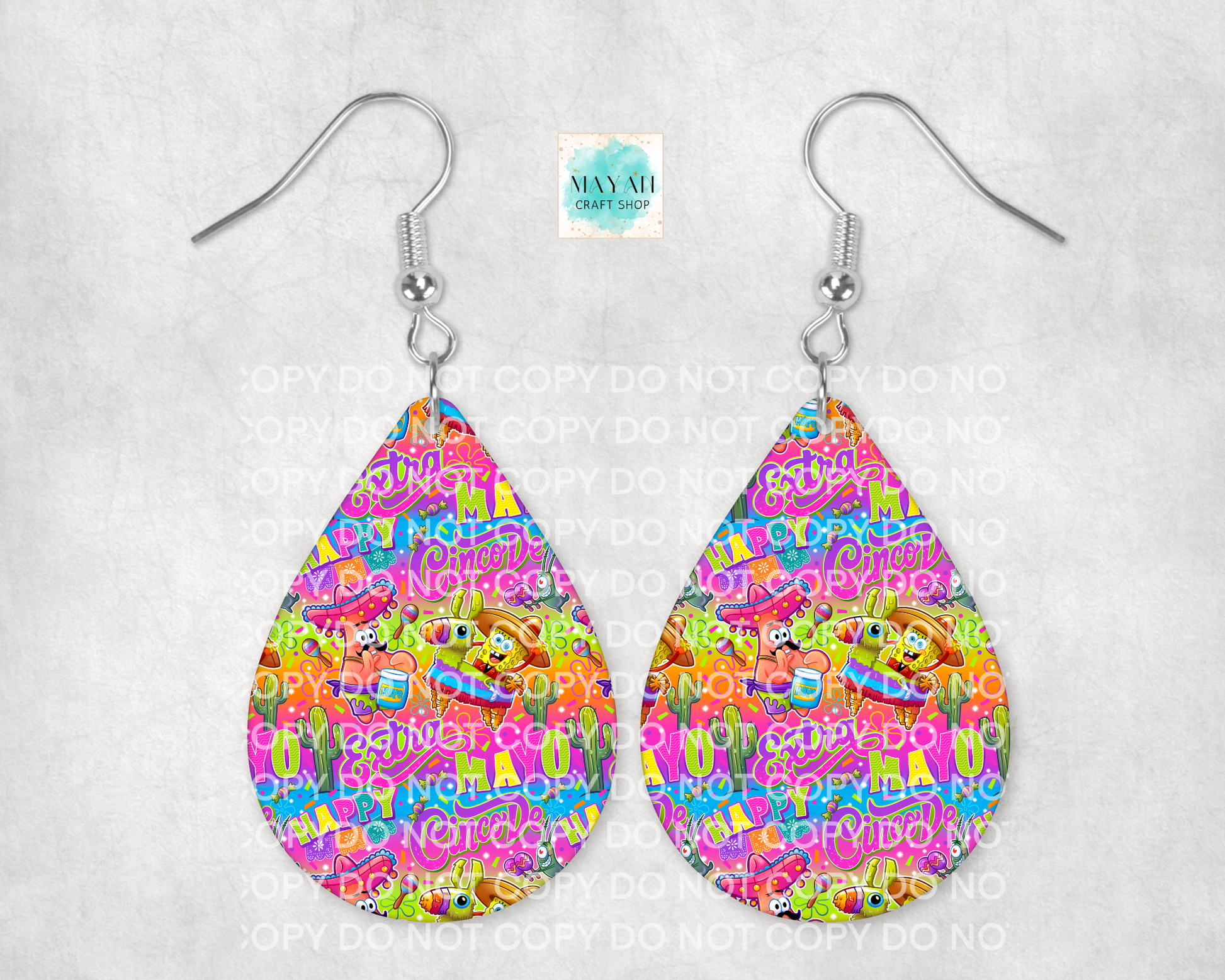 Teardrop-shaped earrings with colorful cartoon pattern on a white background