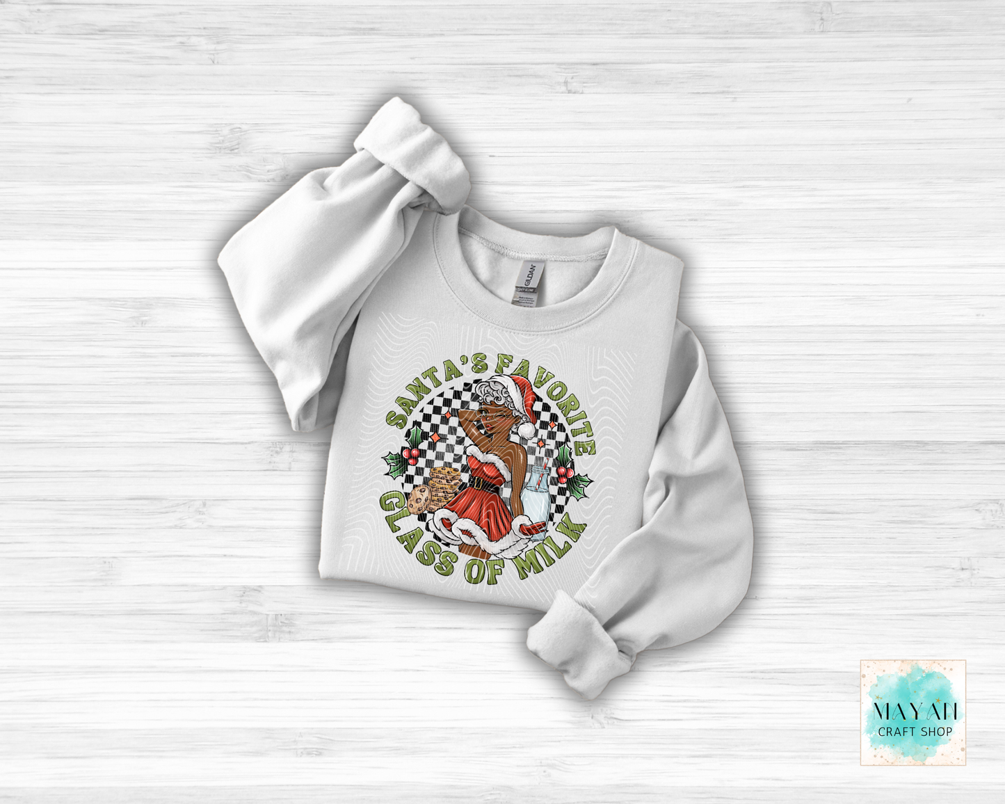 White sweatshirt with a graphic design on a light wooden surface