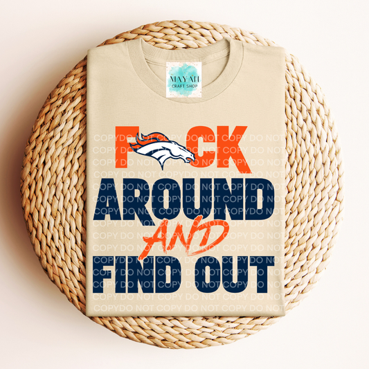 Sand t-shirt with colorful text and logo on a woven surface