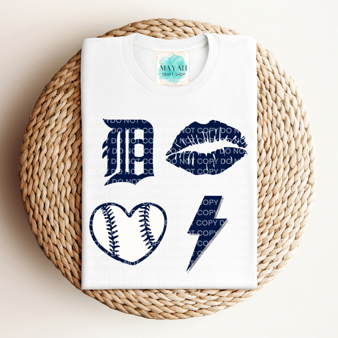 White t-shirt with blue graphic designs on a woven mat