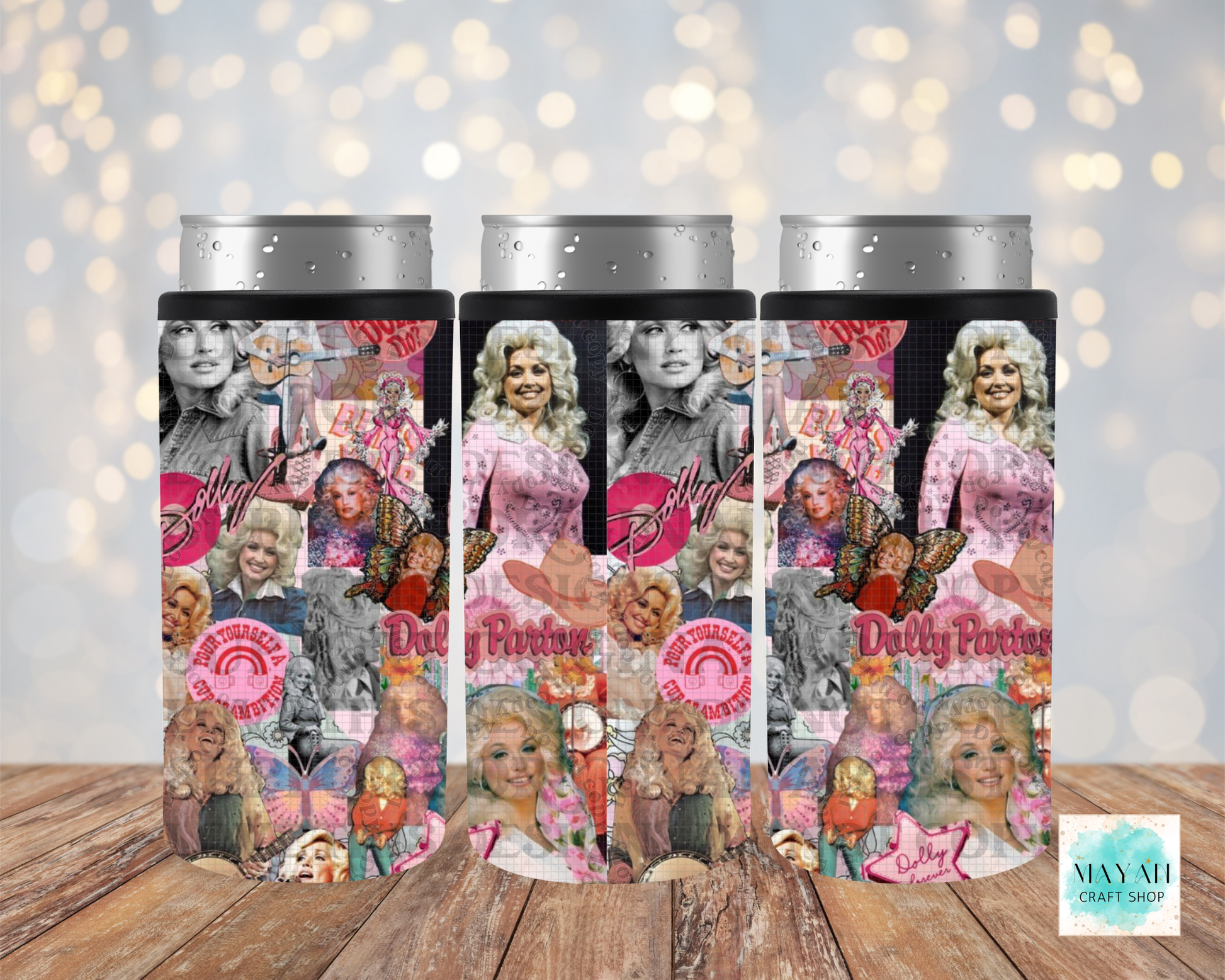 Three slim can coolers featuring a collage print of a country singer imagery including photos, pink logos, and butterflies, displayed on a wooden surface with a bokeh light background.