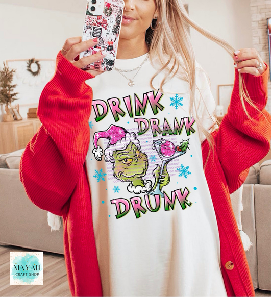 Person wearing a white sweatshirt with a colorful graphic and text, holding a phone with a decorated case.