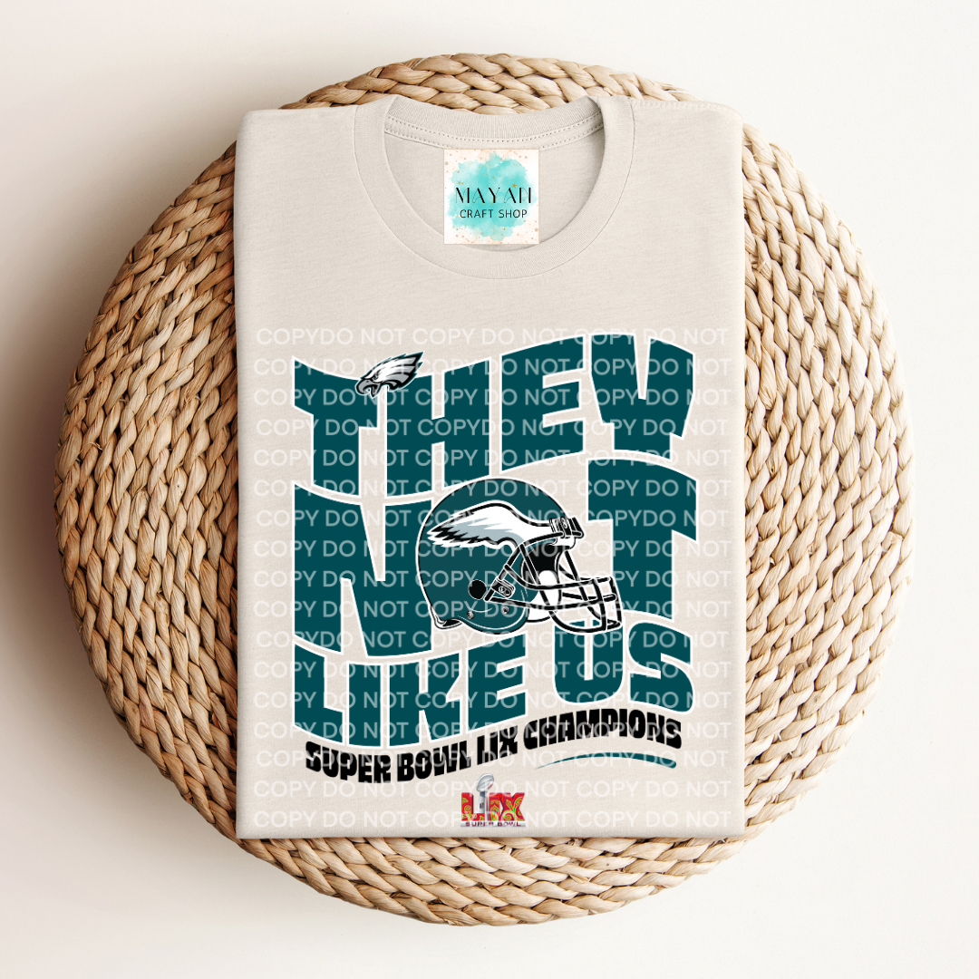 SB 2025 champs not like us heather dust shirt. -Mayan Craft Shop