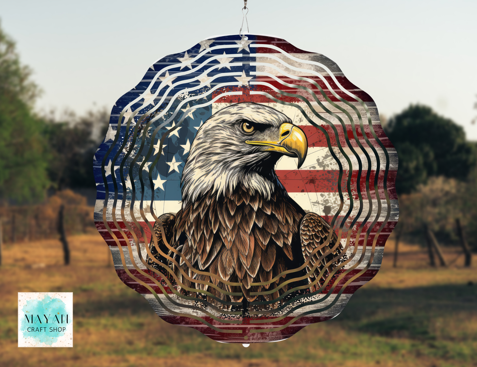 Decorative item with an eagle design inside a circle featuring the American flag, outdoors.