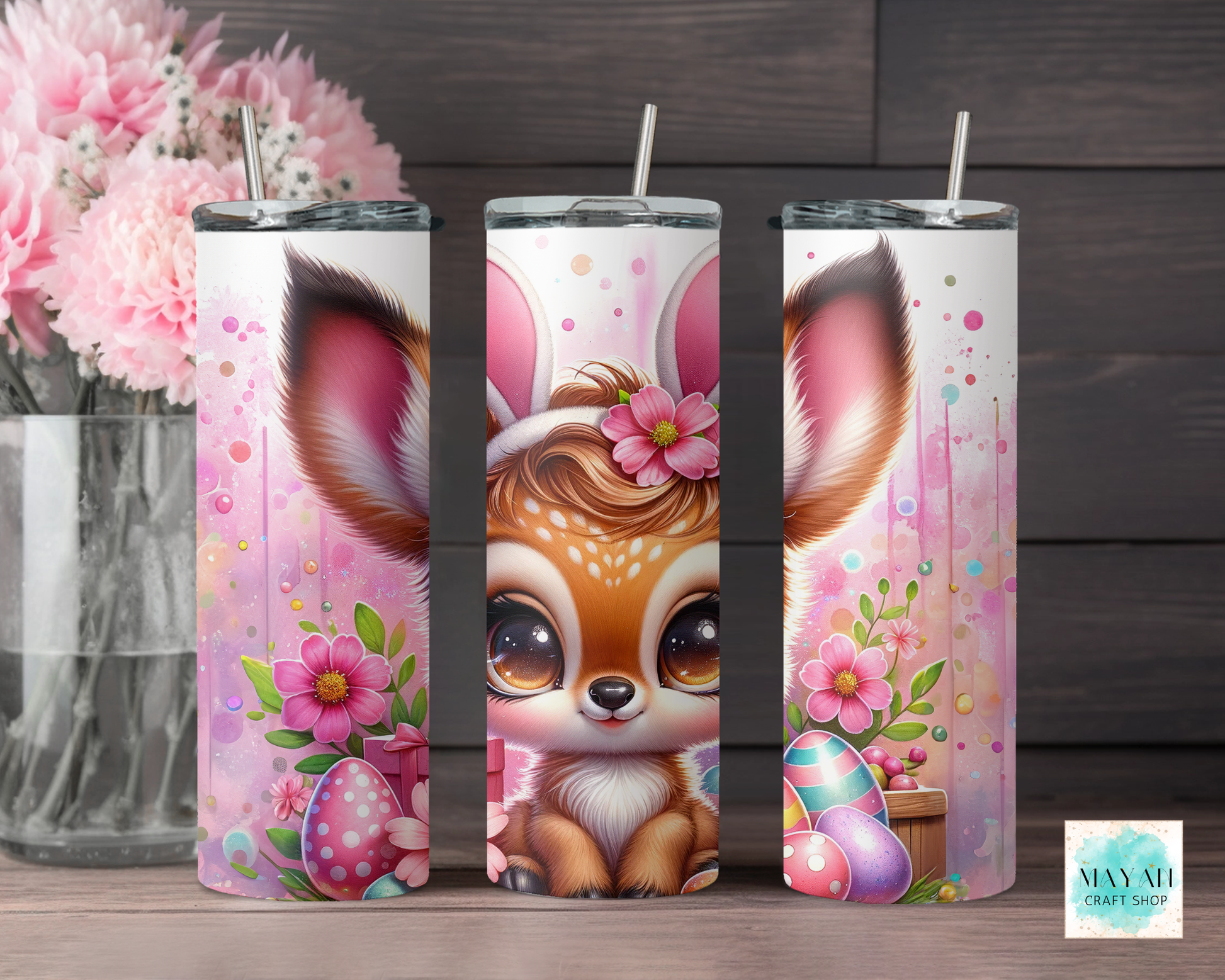 Three tumbler designs featuring animal characters with floral elements on a wooden surface.