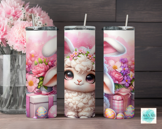 Three tumbler with a cute animal design and floral elements on a wooden surface.