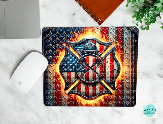 Firefighter-themed mouse pad with American flag design on a marble surface.