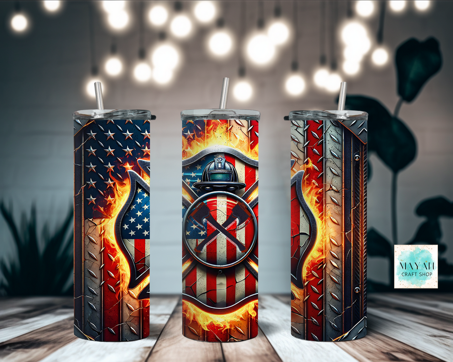 Three metallic tumblers with American flag and firefighter design on a wooden surface.