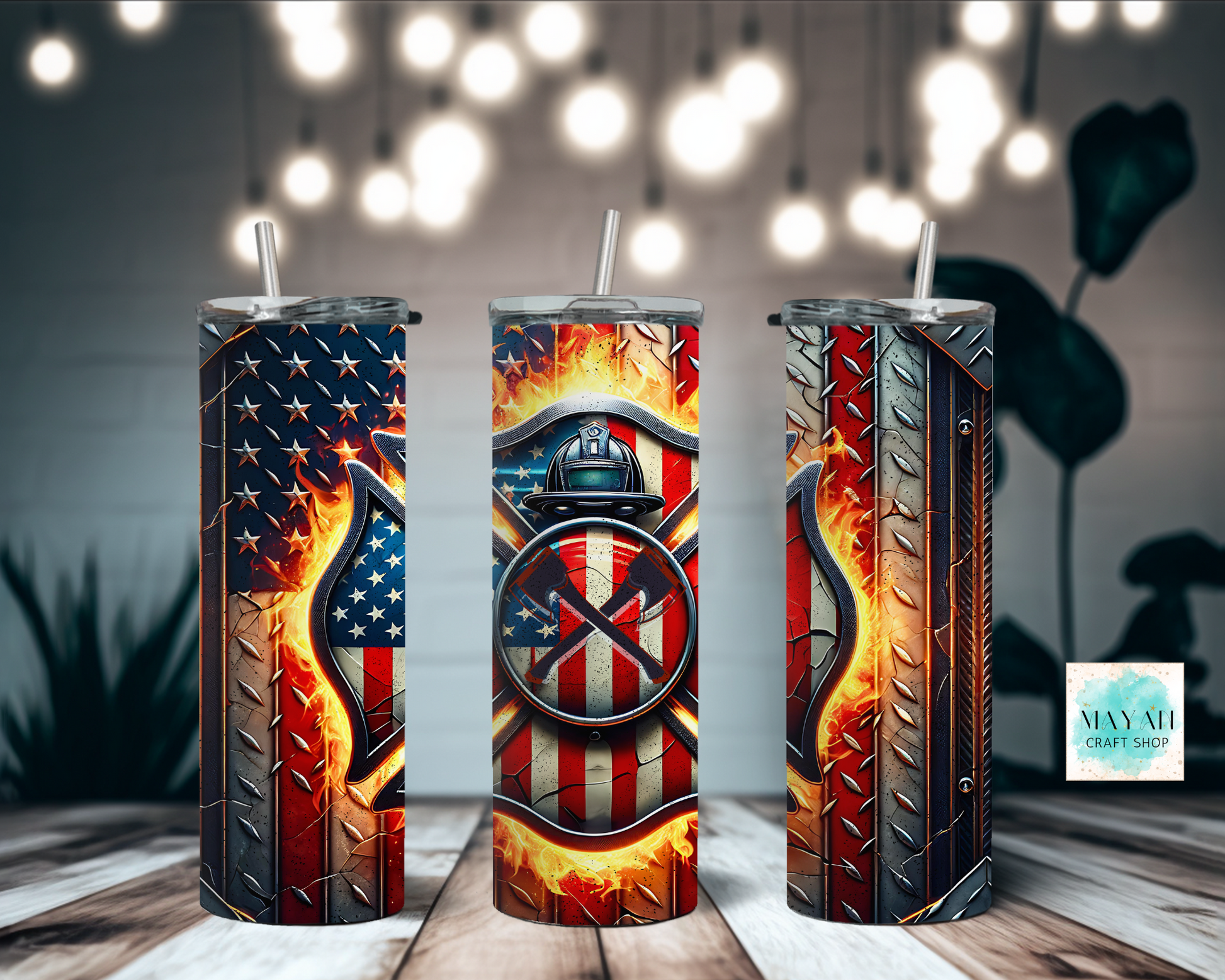 Three metallic tumblers with American flag and firefighter design on a wooden surface.