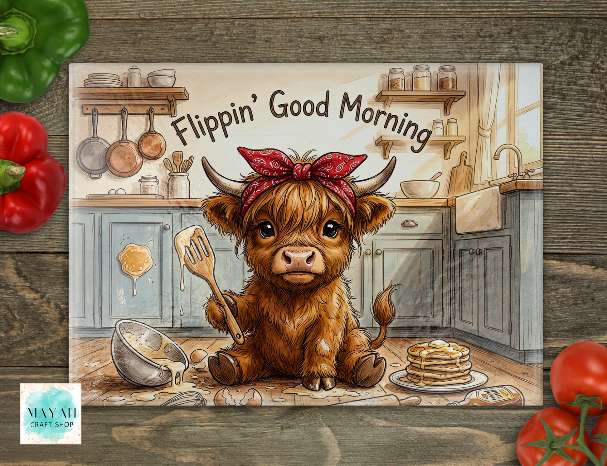 Cartoon cow with a bandana in a kitchen holding a spatula, with 'Flippin' Good Morning' text.