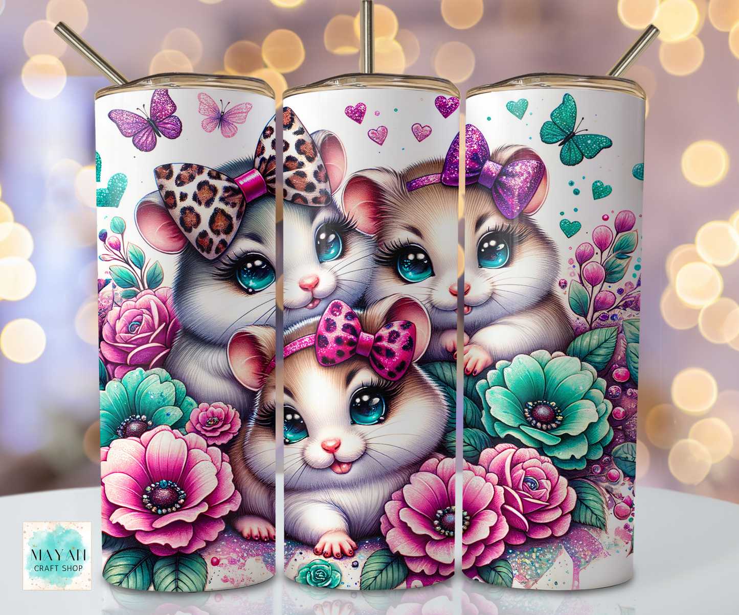 Tumbler with cartoon hamsters and floral design on a blurred lights background