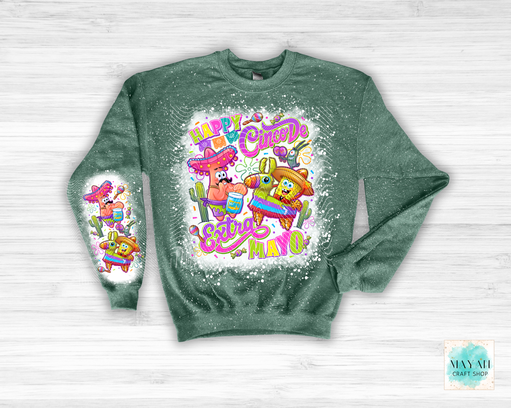Green sweatshirt with colorful graphic design on a white background