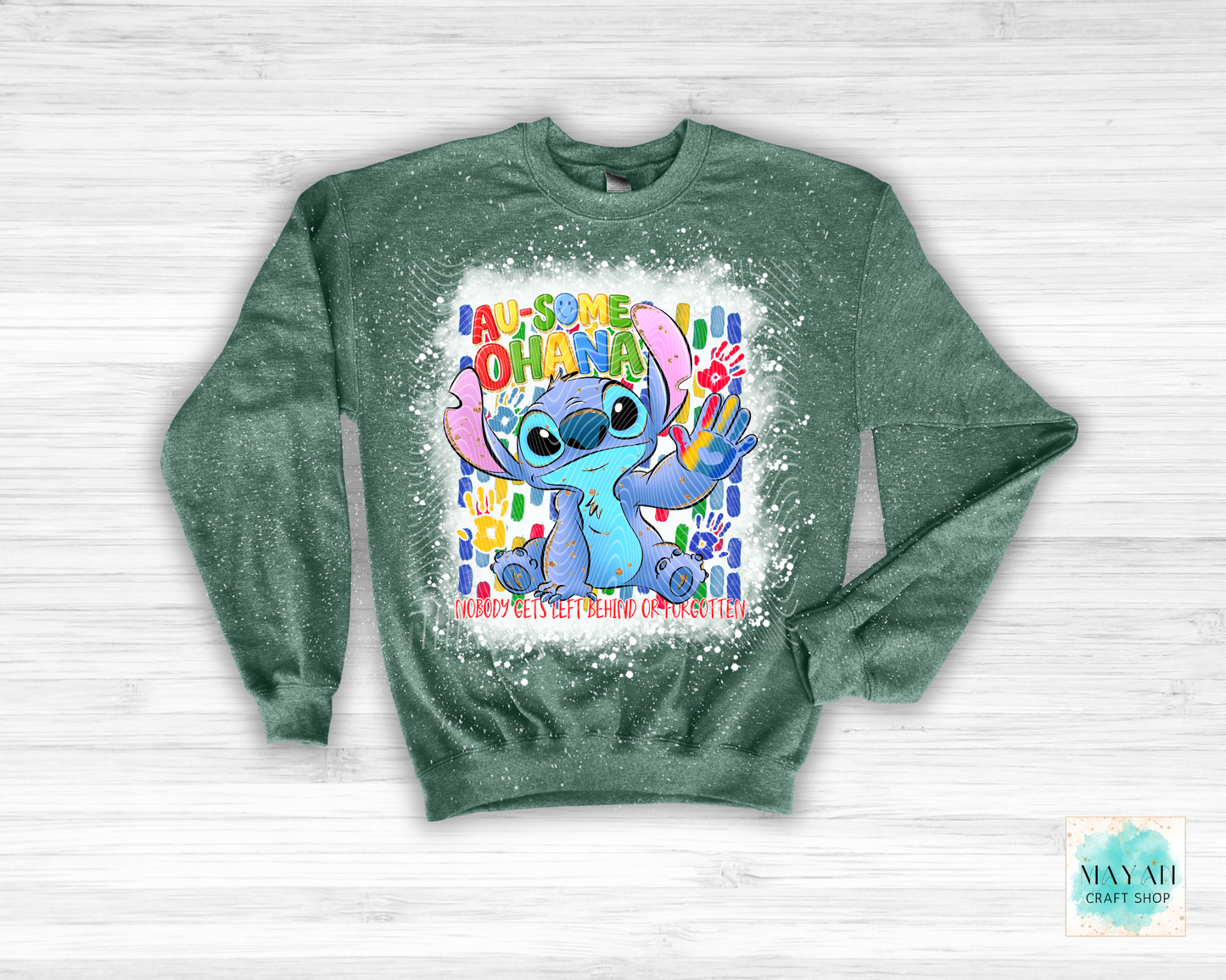 Green sweatshirt with cartoon character and colorful text on a white background