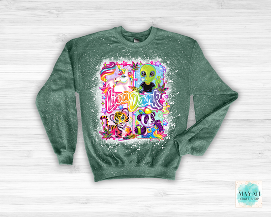 Green sweatshirt with colorful graphic design on a white wooden background