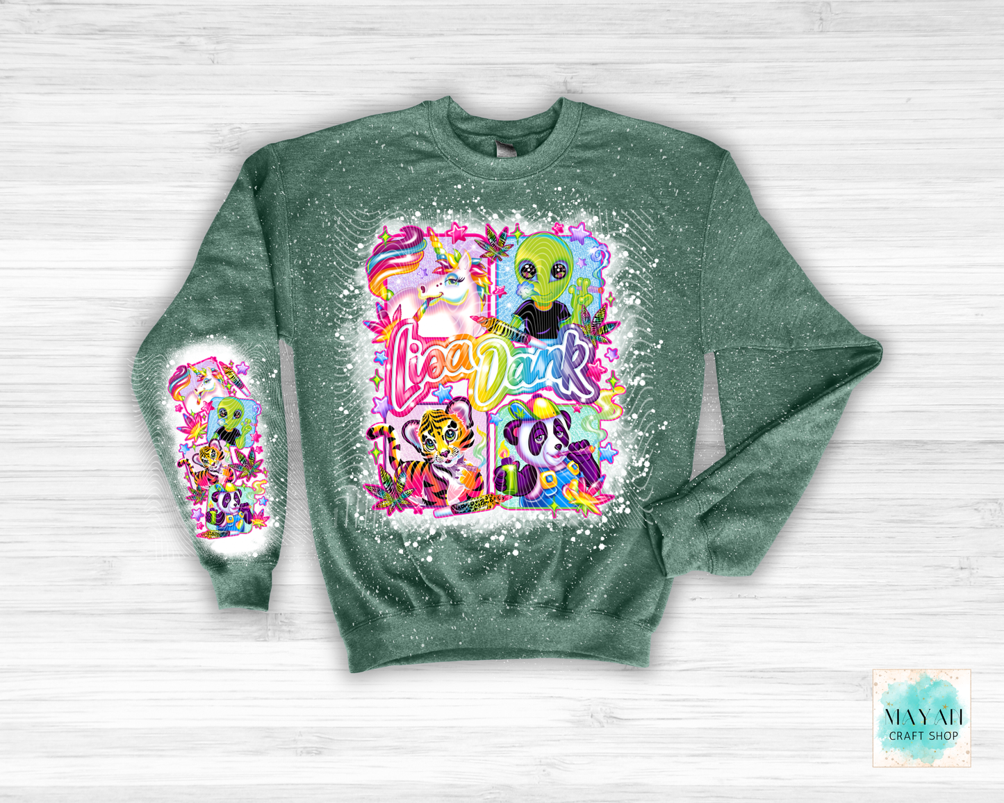 Green sweatshirt with colorful graphic design on a white wooden background