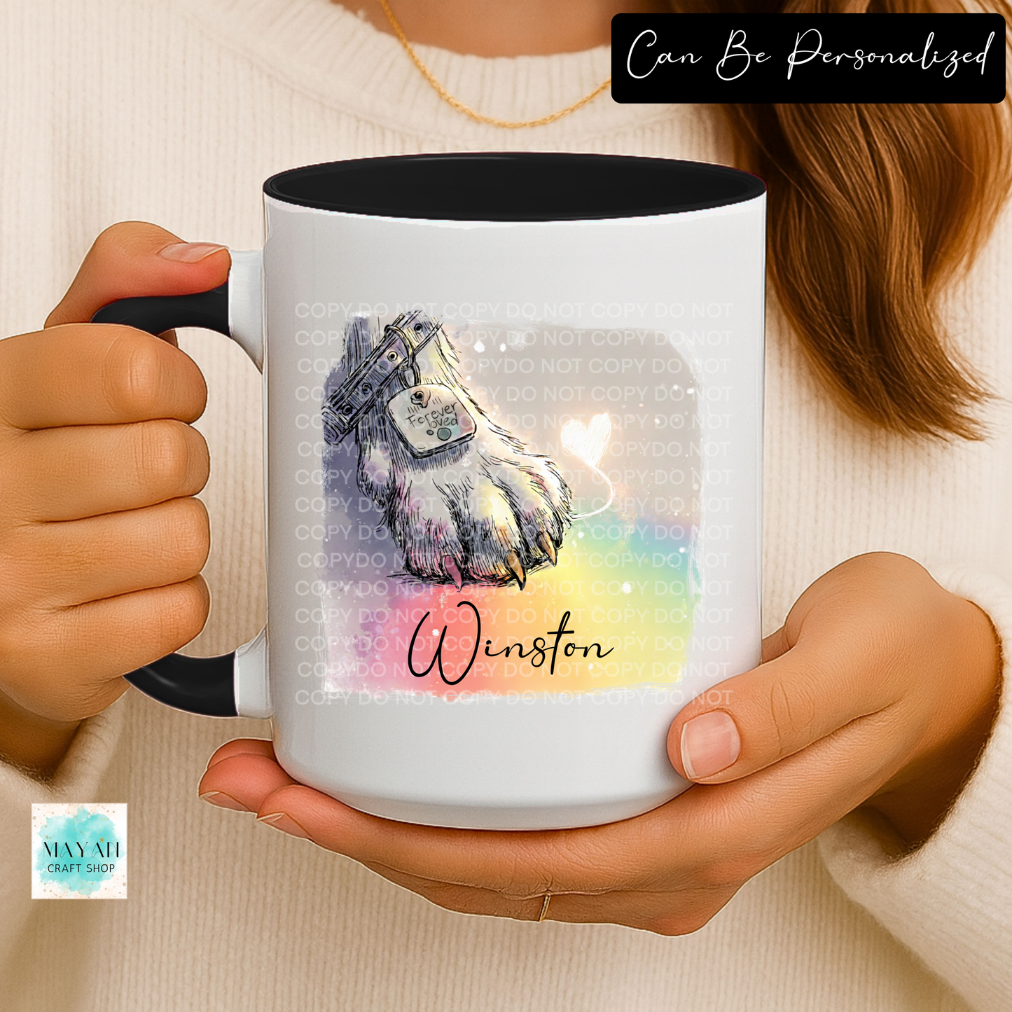 Person holding a mug with a personalized design of a dog.
