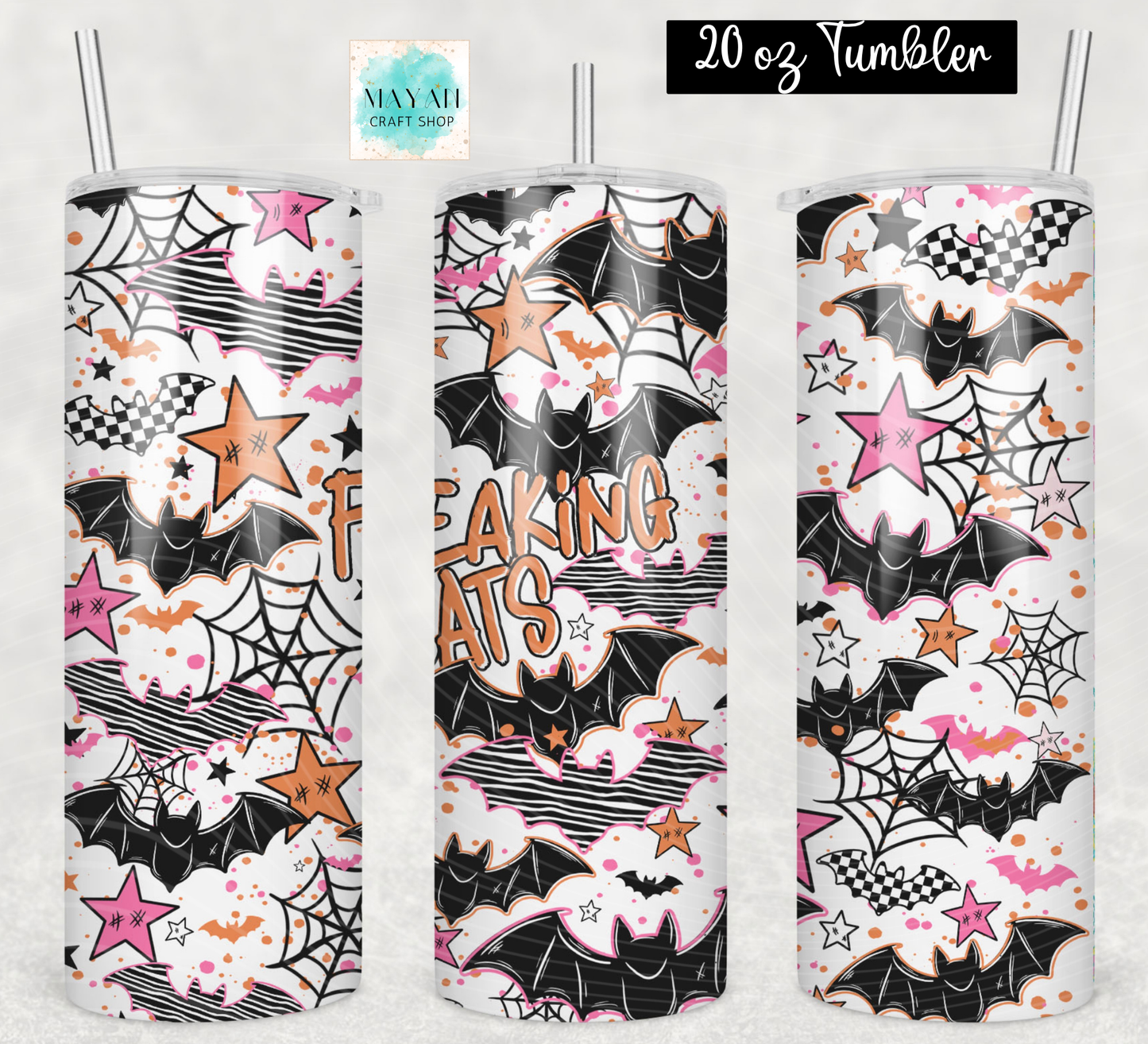 Three 20 oz tumblers with clear straws, featuring a Halloween-themed print with bats, spiderwebs, stars, clouds, and the words 'FREAKING BATS' in orange. The background is a light textured gray.