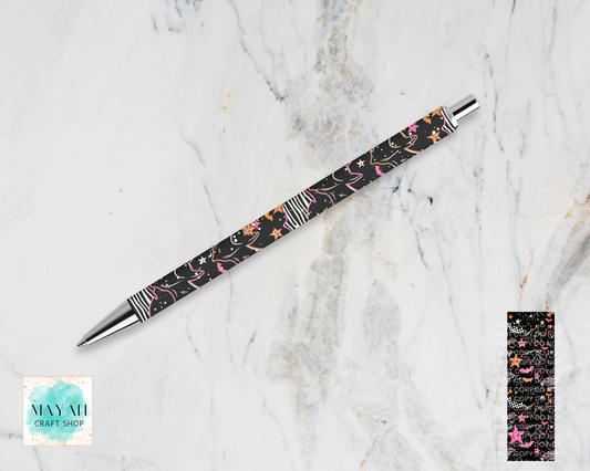 A ballpoint pen with a black barrel featuring a pink, orange, and white floral pattern, silver metal accents, and striped end caps, displayed diagonally on a white marble background.