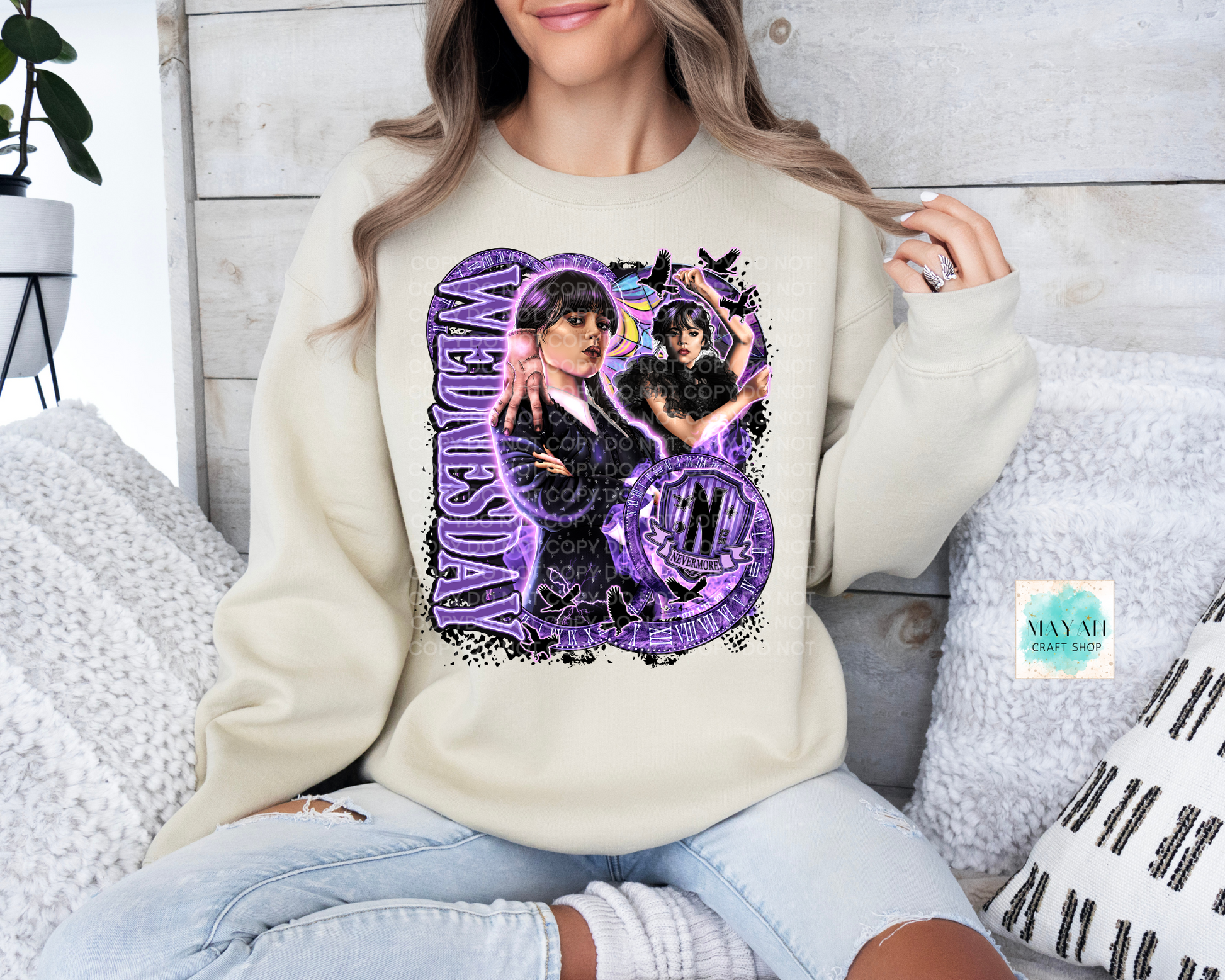Purple design on ash sand sweatshirt.