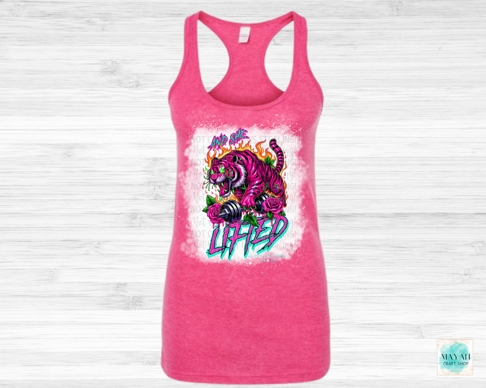 And she lifted heather fuchsia bleached tank top. -Mayan Craft Shop