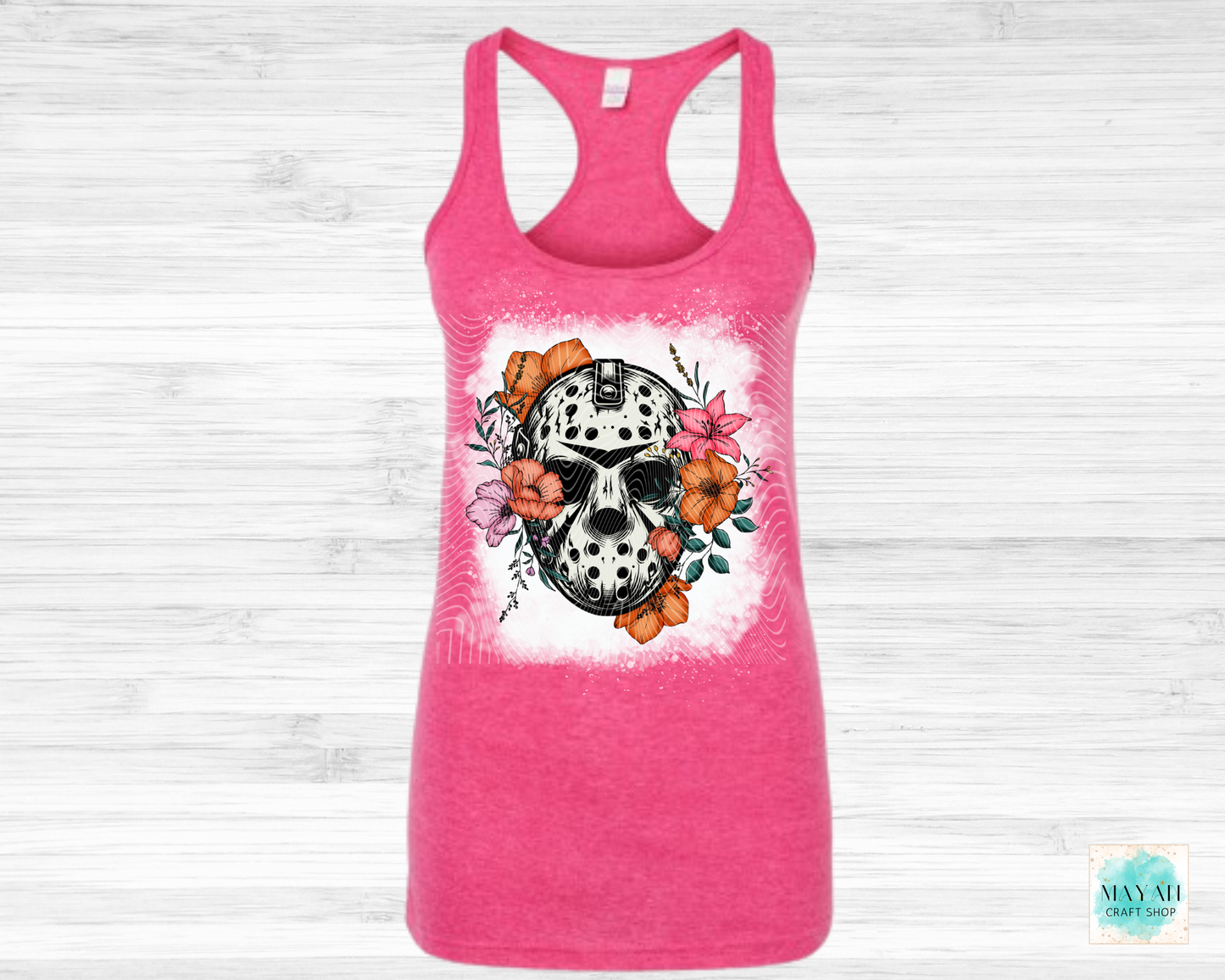 Pink tank top with a skull and floral design on a white background