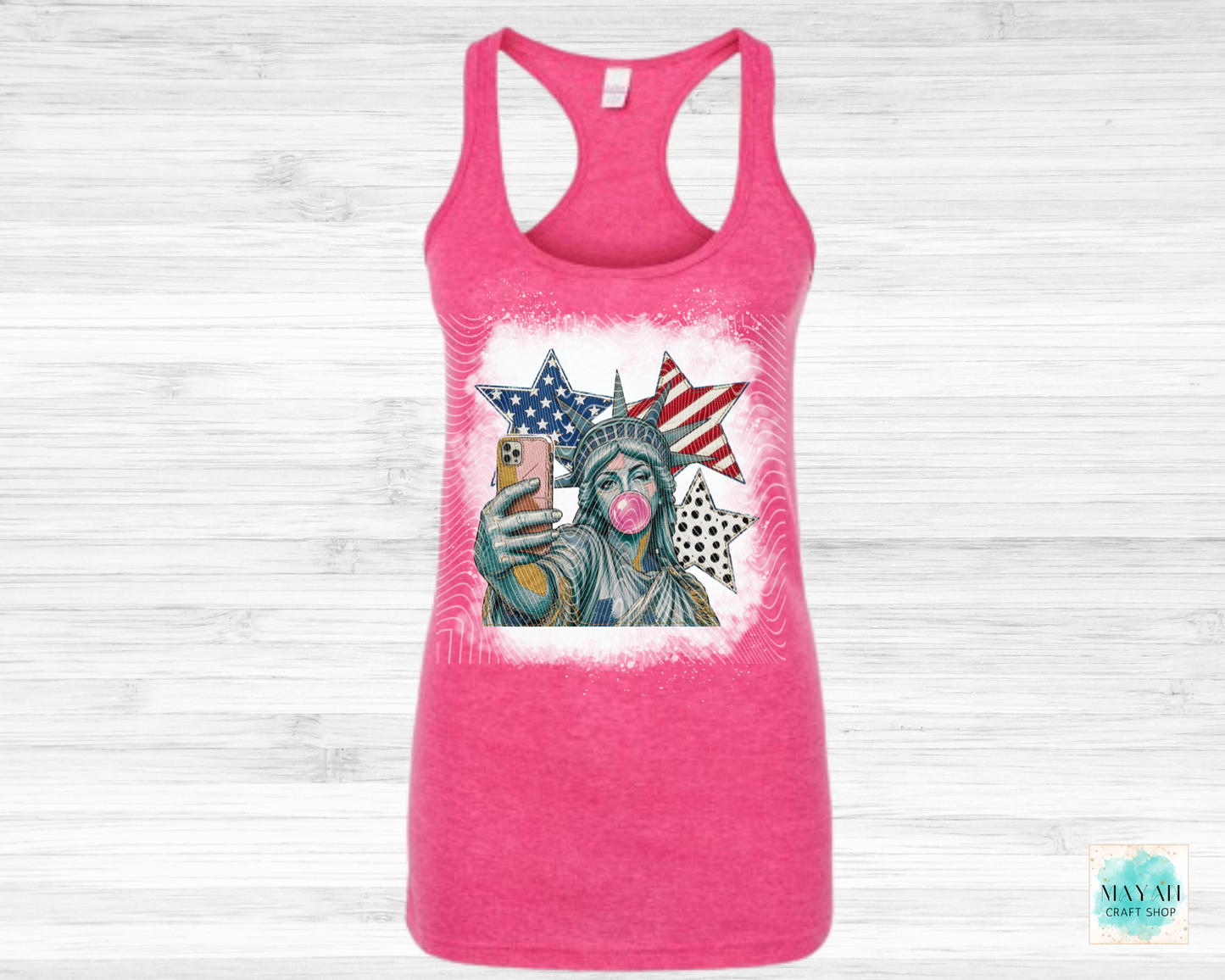 Pink tank top with a graphic of the Statue of Liberty on a white background