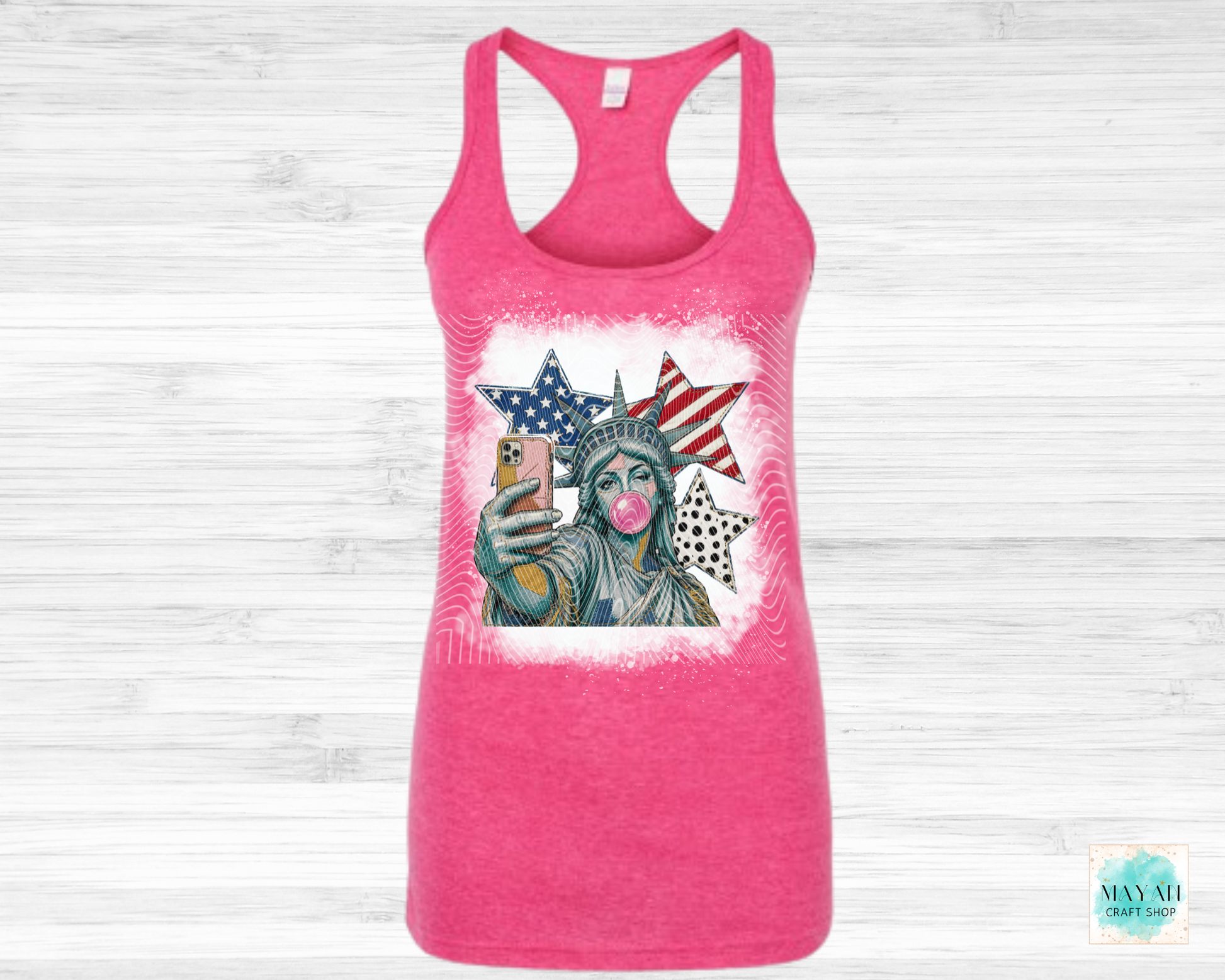 Pink tank top with a graphic of the Statue of Liberty on a white background