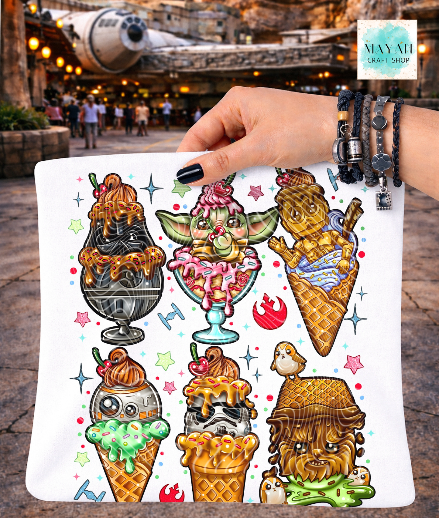 Shirt with ice cream cone designs held by a hand in front of a war ship themed background.