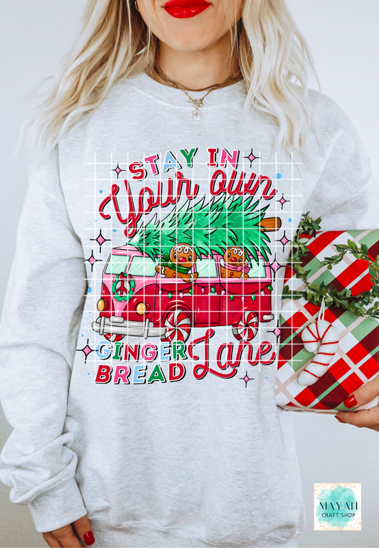 Person wearing a Christmas-themed sweatshirt with festive graphics and text.