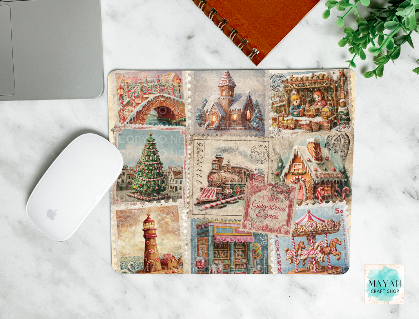 Decorative mouse pad with vintage-style illustrations on a marble surface.