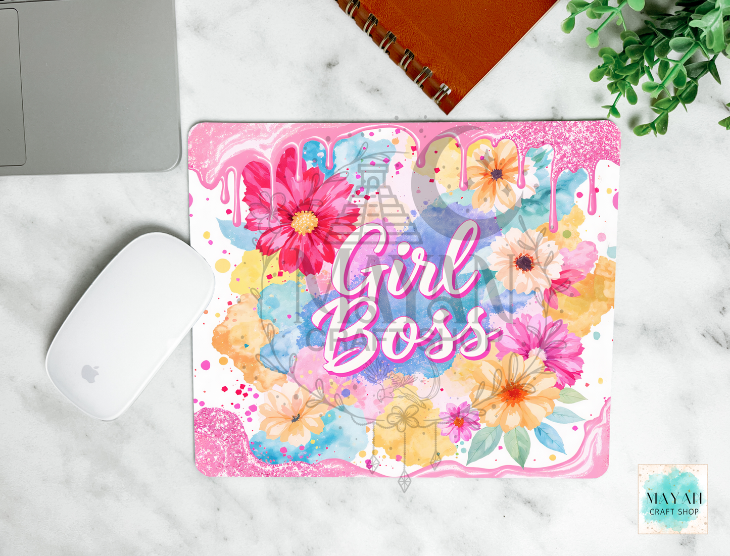 Colorful mouse pad with 'Girl Boss' text on a marble surface