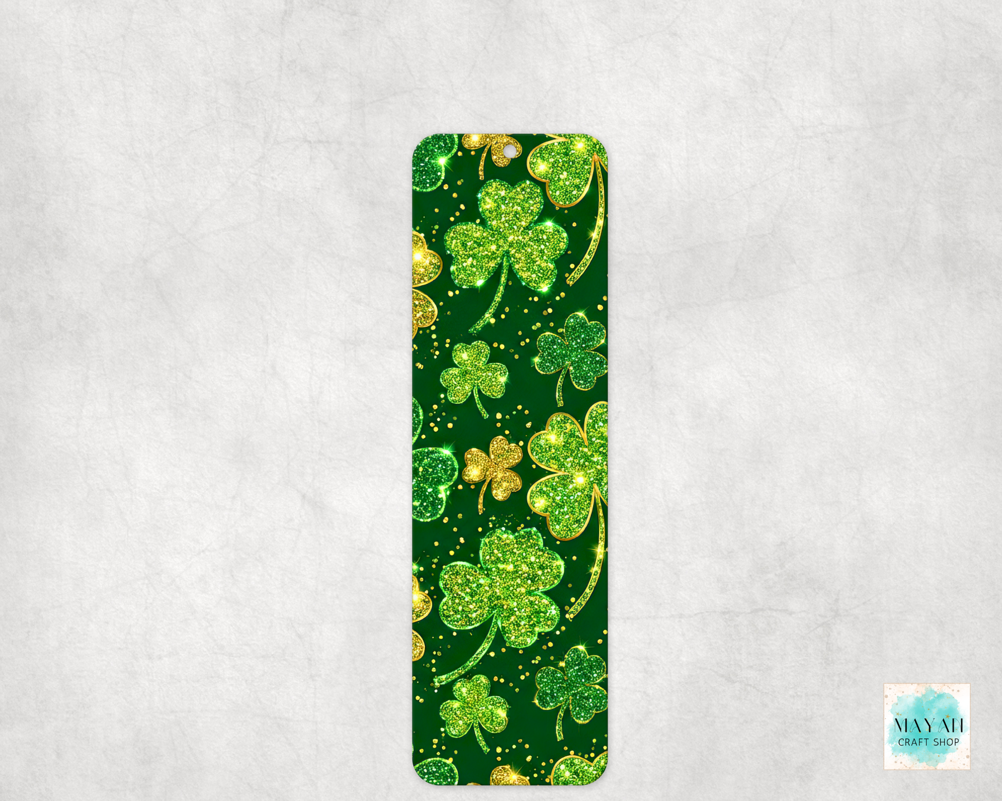 Green and gold shamrock patterned bookmark on a light gray background