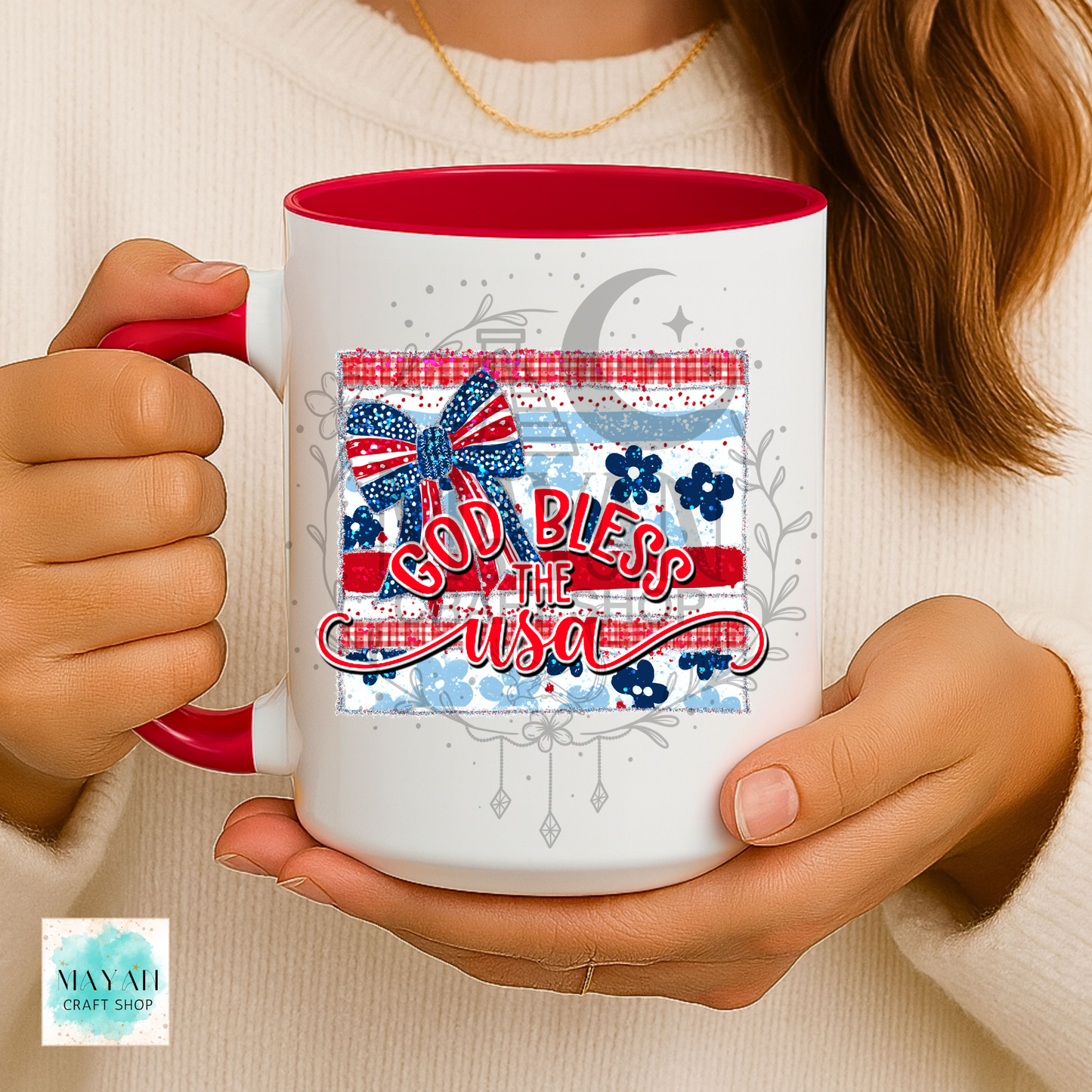 Person holding a mug with 'God Bless the USA' design