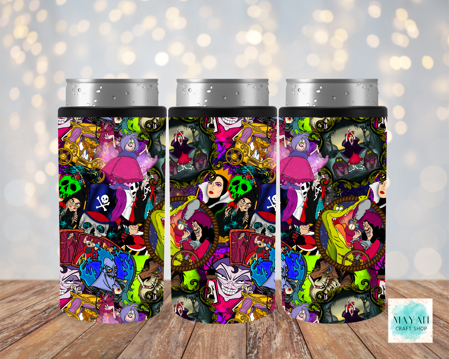 Three colorful tumblers with cartoon character designs on a wooden surface.