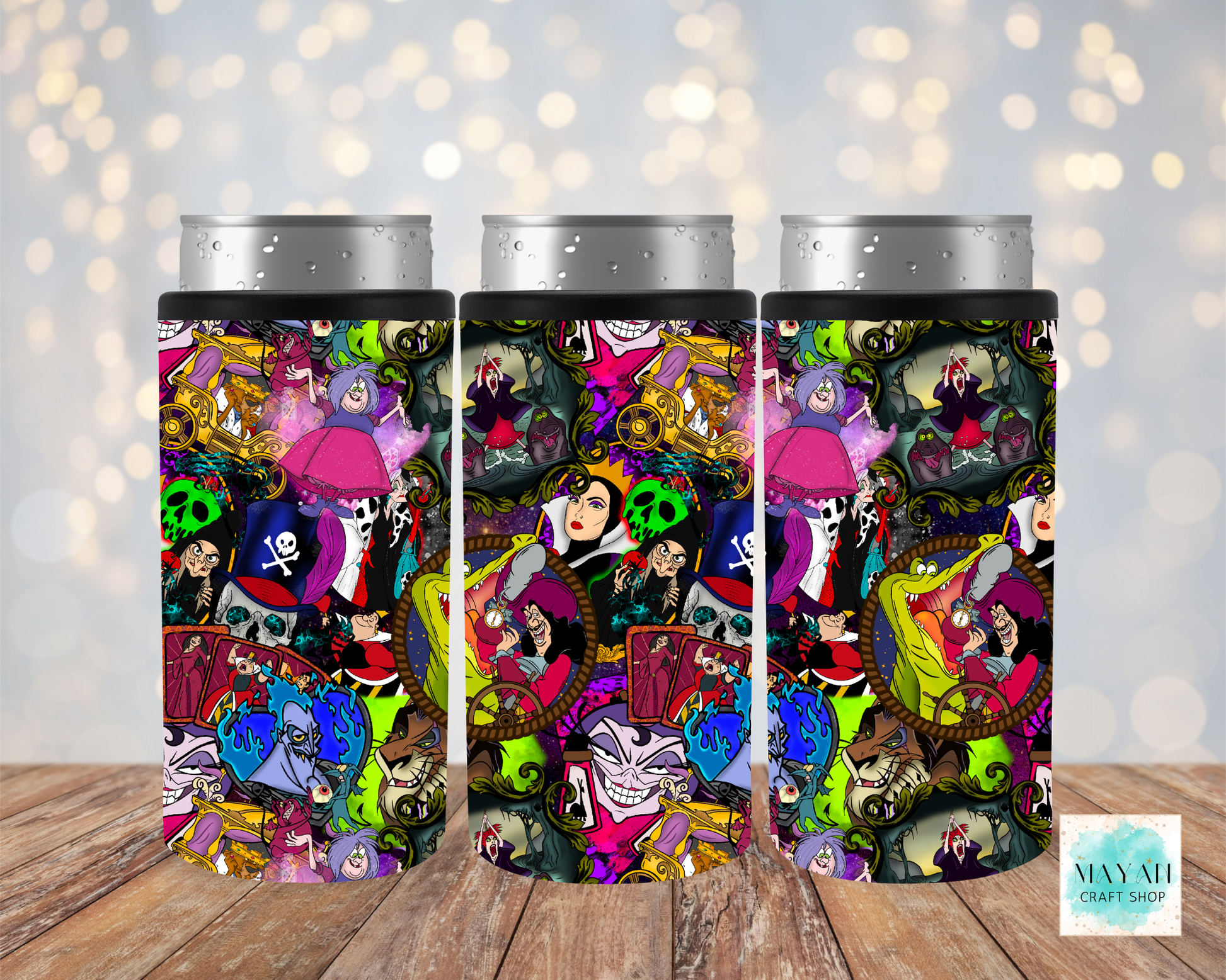Three colorful tumblers with cartoon character designs on a wooden surface.