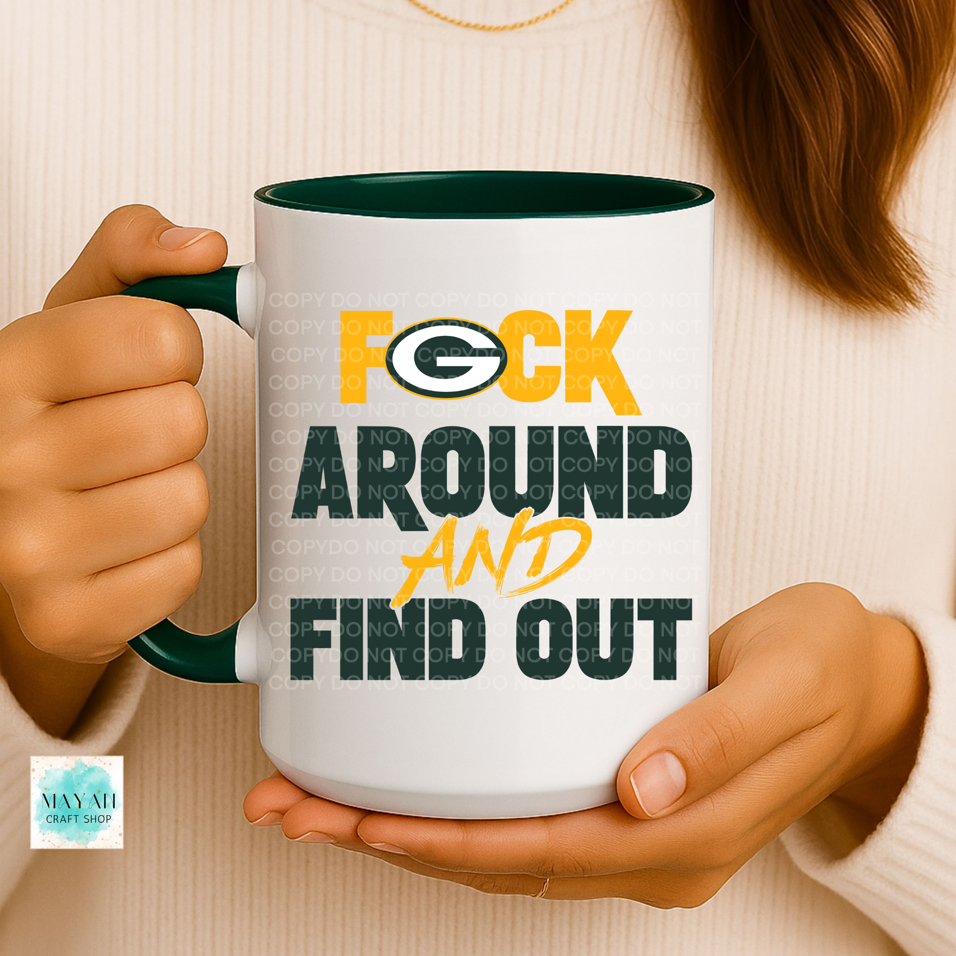 Person holding a mug with text and logo, brand logo visible