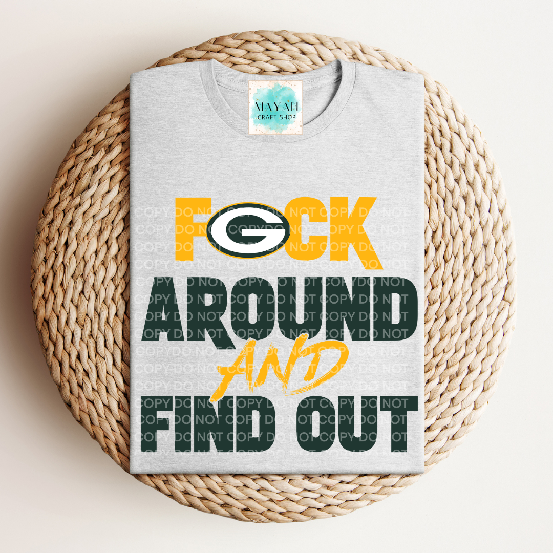 Gray t-shirt with colorful text and logo on a woven surface