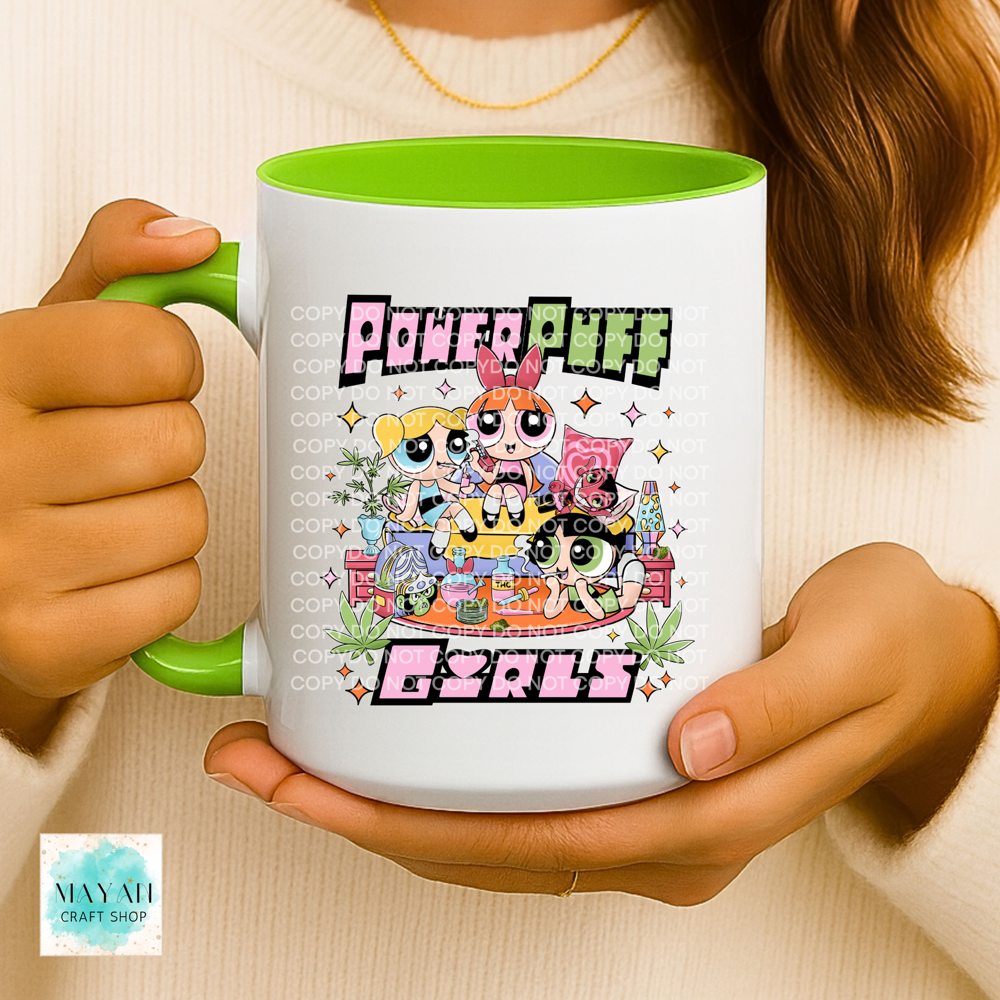 Person holding a mug with vibrant design