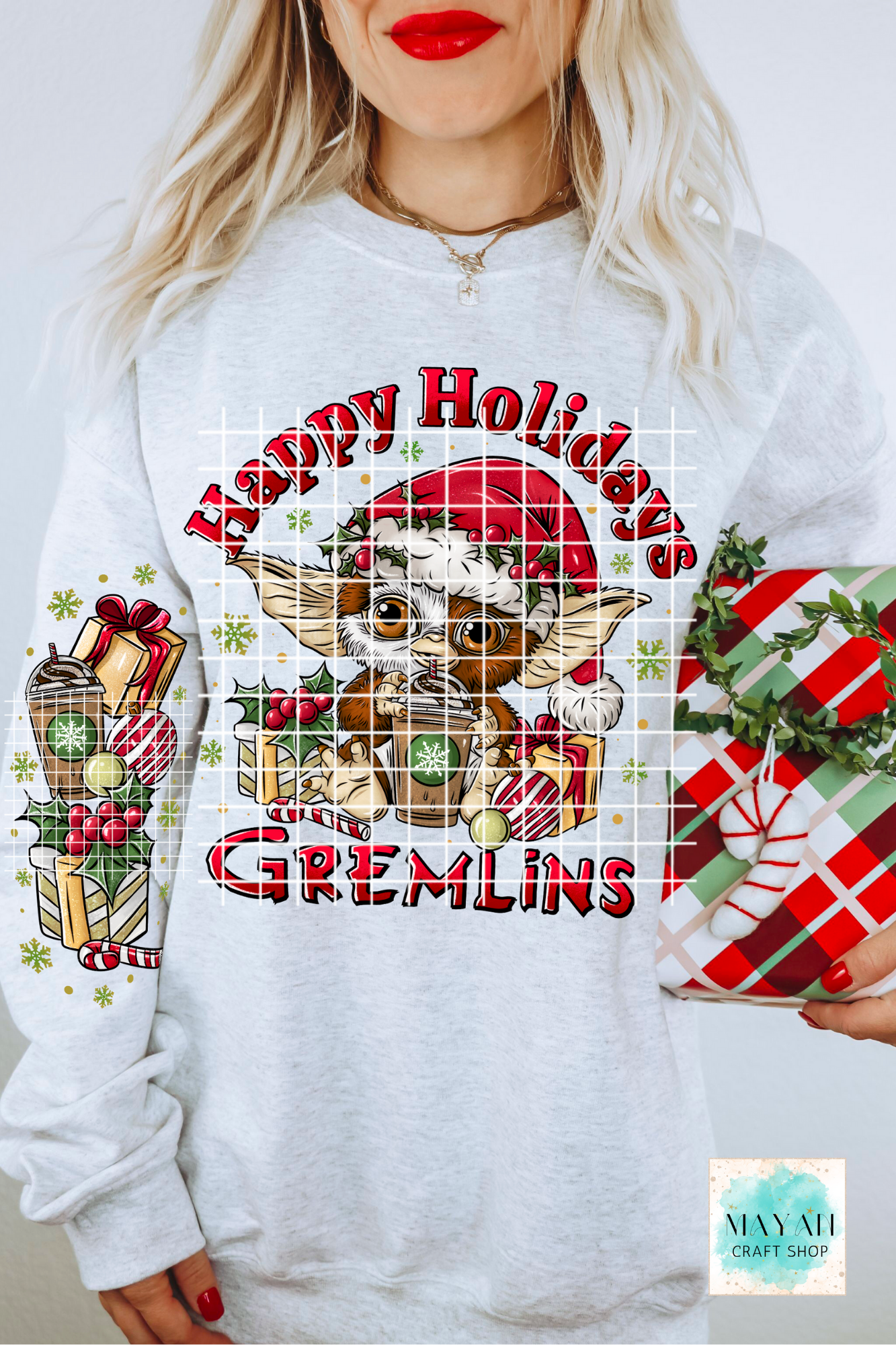 White sweatshirt with 'Happy Holidays' design featuring a cartoon character and festive elements.