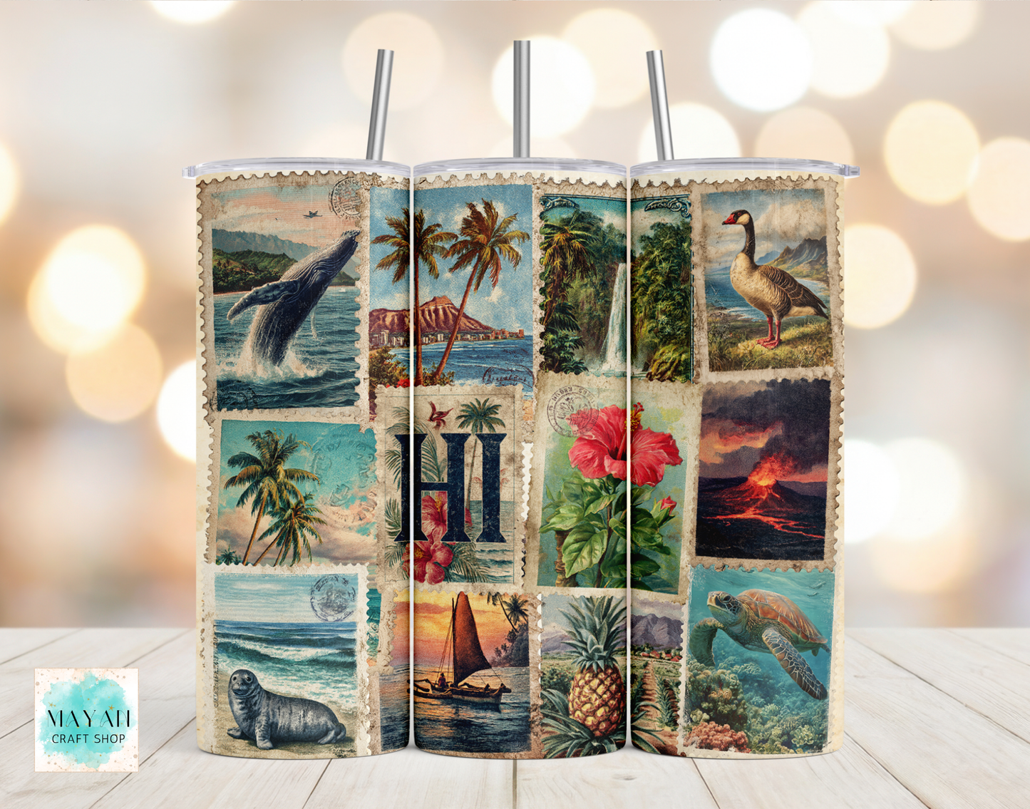 Tumbler with scenic design featuring various landscapes and animals on a blurred background.