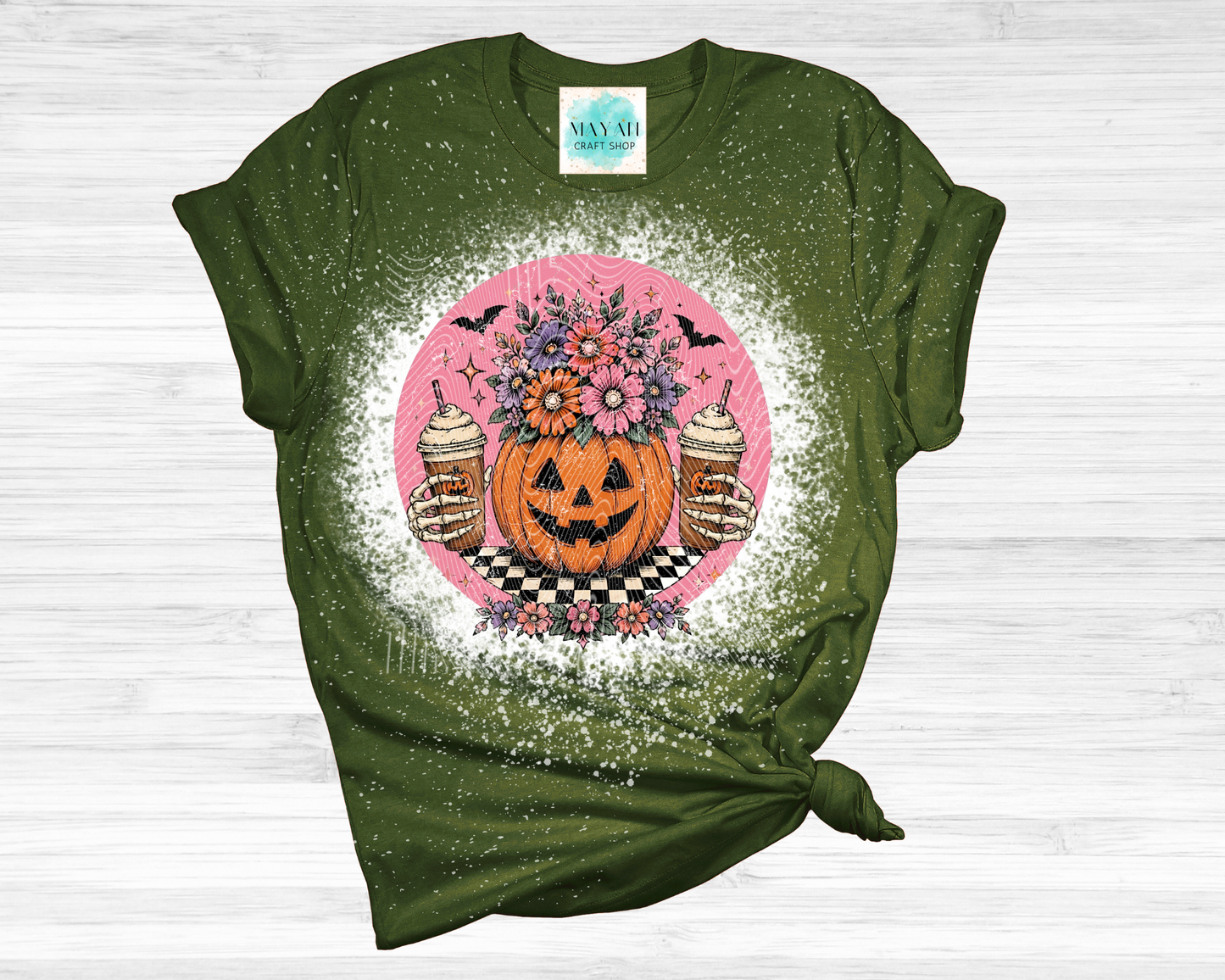 Green t-shirt with Halloween-themed graphic on a white background