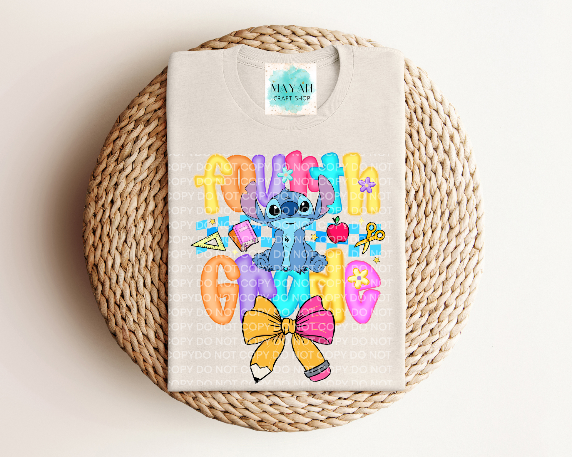 heather dust shirt with colorful design featuring a character and text on a woven surface