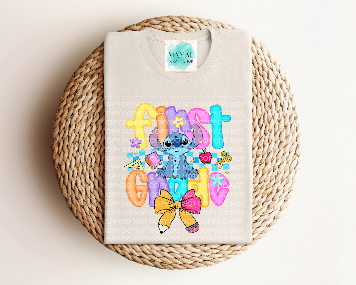 Heather dust shirt with colorful character design and text on a woven mat
