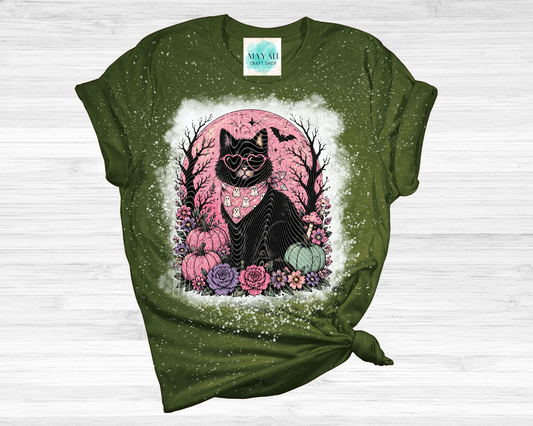 Green t-shirt with a black cat graphic on a white background