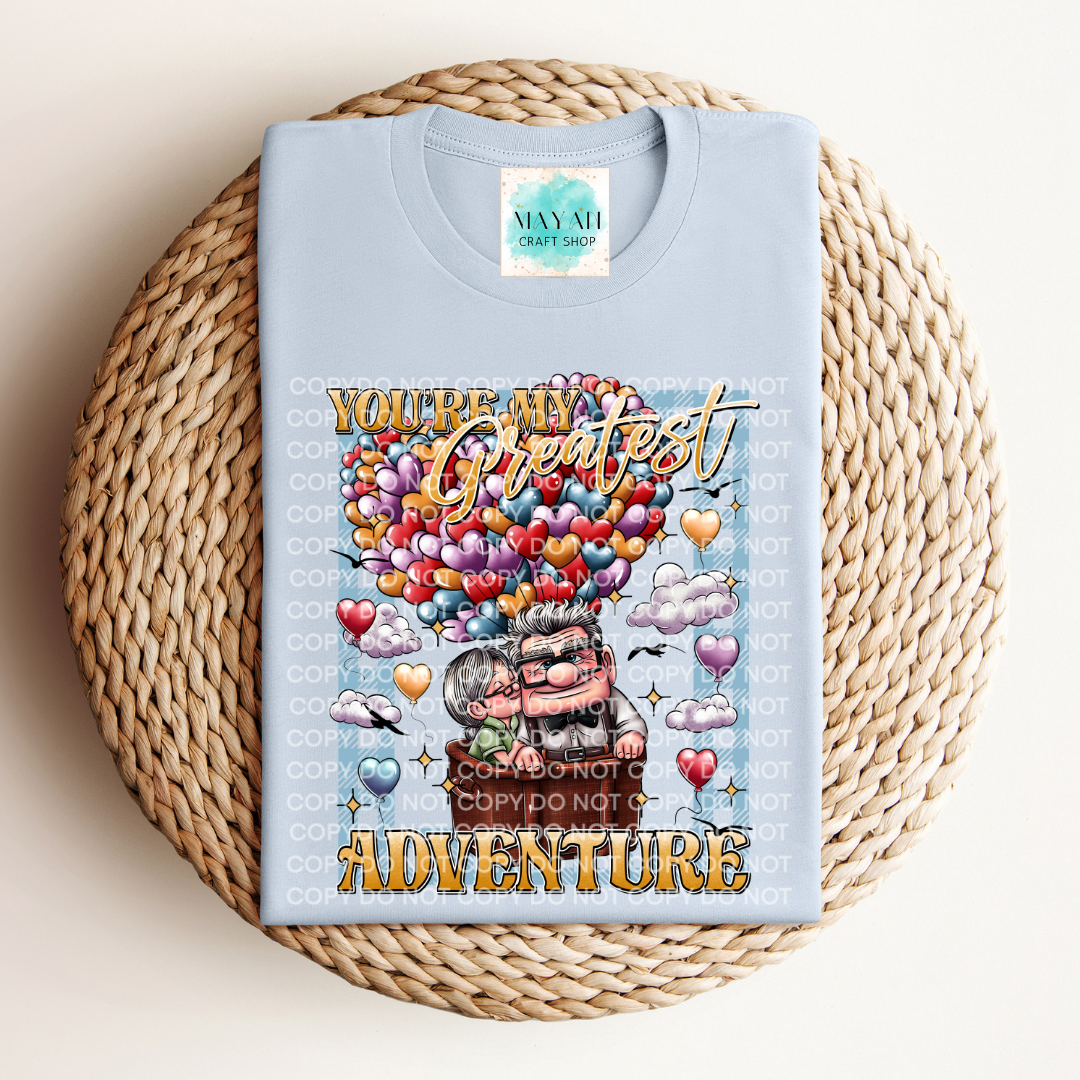 My greatest adventure heather light blue shirt. -Mayan Craft Shop